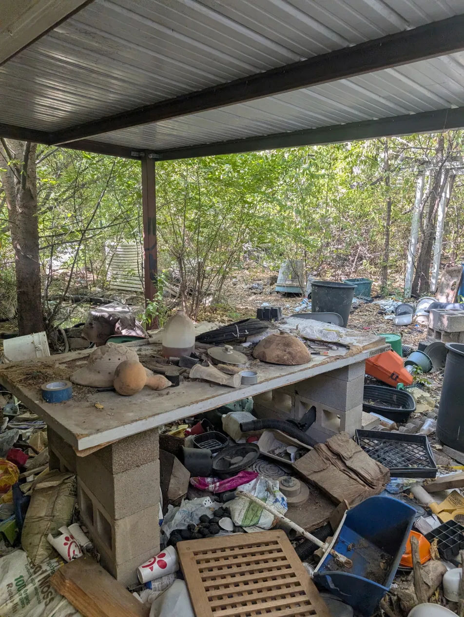 Distressed DFW rental property, another view of the backyard before rehab showing condition at purchase