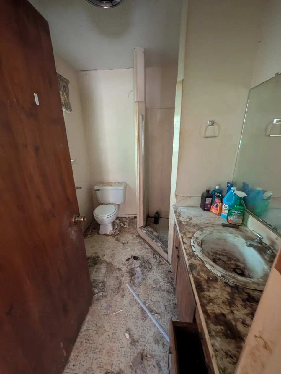 Bathroom condition on DFW rental property before rehab, purchase price $103,500